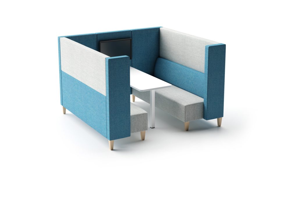 Modular breakout booth with blue and light grey upholstered panels, two benches, a white table, and a screen.