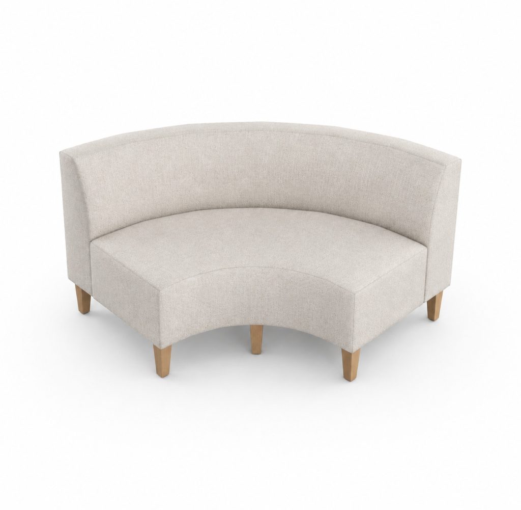 Curved modular breakout seating unit with a low back and wooden legs, on a white background.