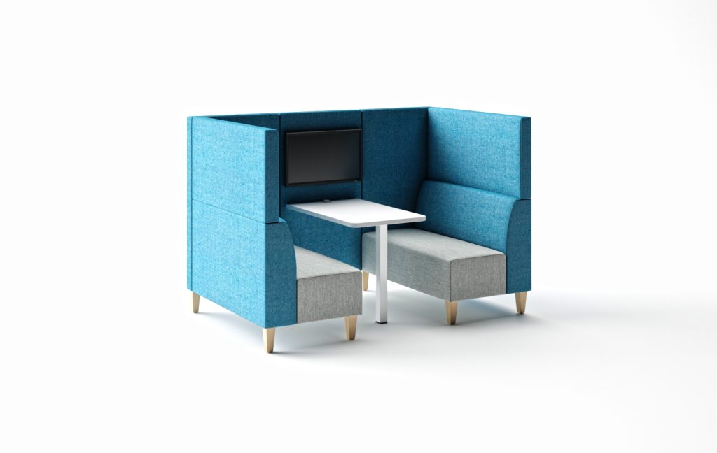 Modular breakout booth with blue upholstered high back, grey seats, white table, and mounted screen.